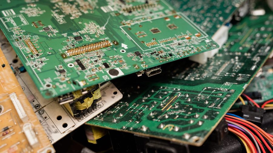 Television mainboard being examined on a repair bench