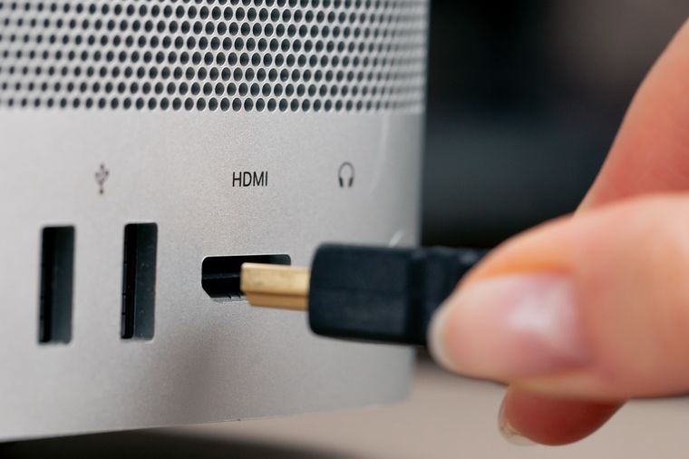 Close-up of HDMI and USB ports on the back of a television being repaired for input faults