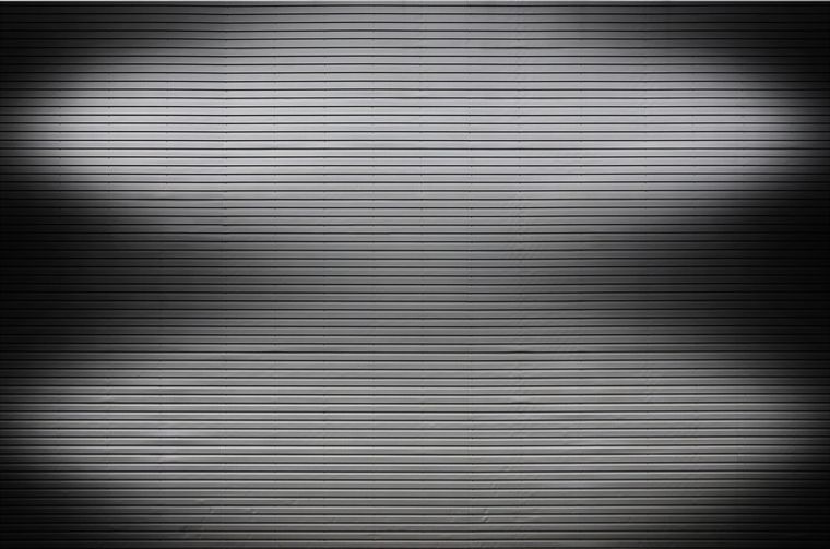 Television screen displaying vertical lines and shadows caused by a faulty T-Con board